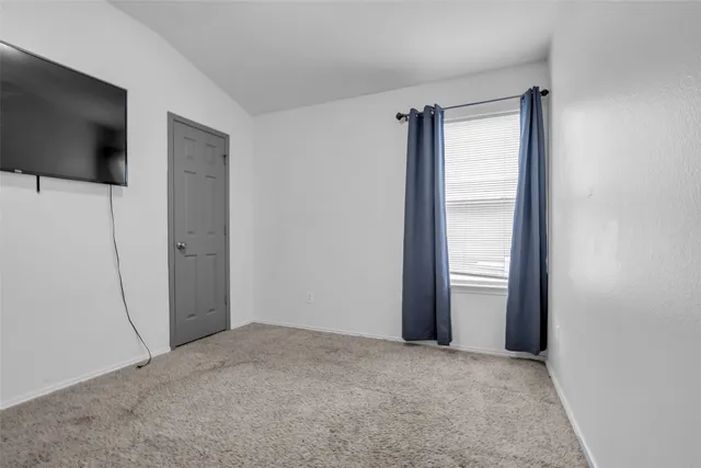 a view of empty room with front door