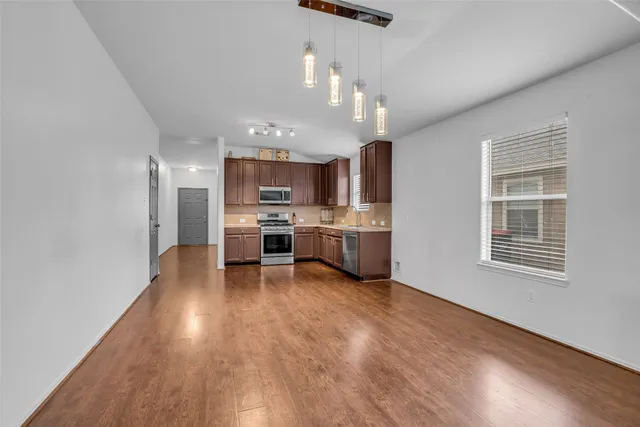 a view of kitchen with sink microwave and stove
