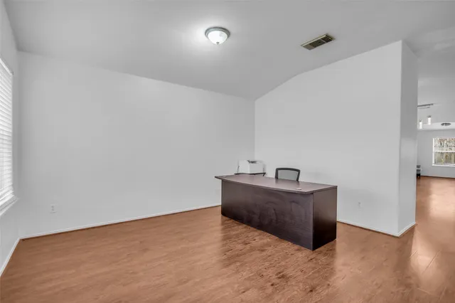 a room with a sink and mirror