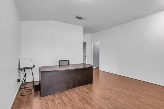 a kitchen with granite countertop a sink and a stove top oven