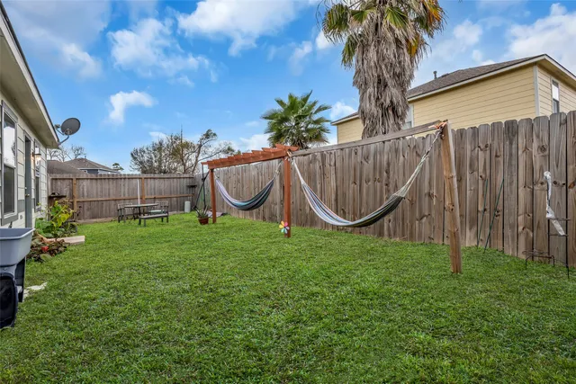 a garden with wooden fence