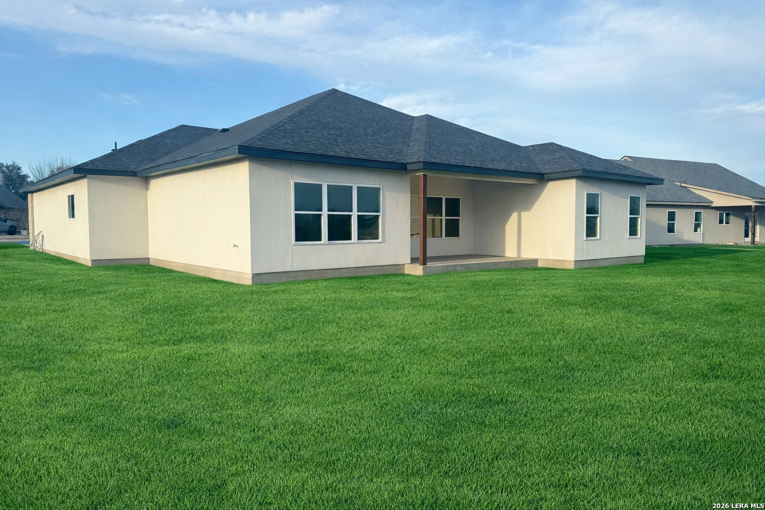 705 34th Street Hondo, TX 78861 - Photo 4 of 4 a front view of a house with yard
