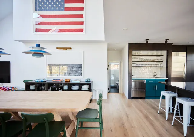 a kitchen with a table and chairs