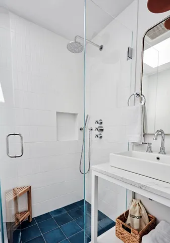 a bathroom with a sink and mirror