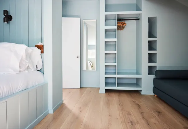 a view of walk in closet with empty racks