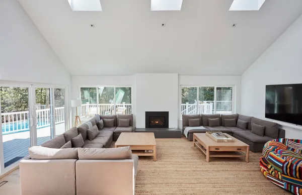 a living room with furniture window and a fireplace