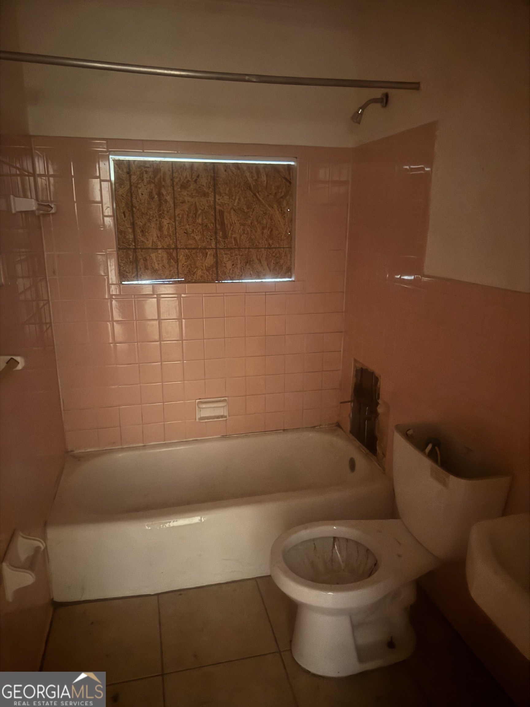 2937 Thomas Street, Unit 1A1B Columbus, GA 31906 - Photo 10 of 11 a bathroom with a toilet and a shower