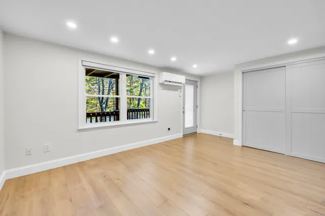 a view of an empty room with a window