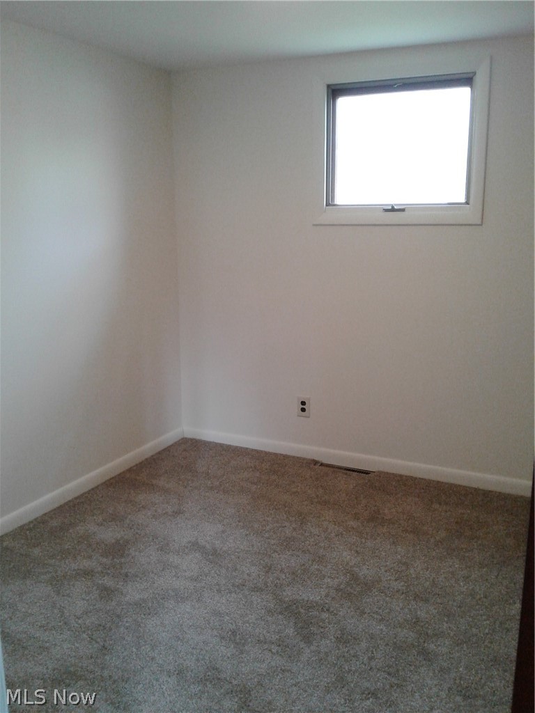 613 Jackson Street Amherst, OH 44001 - Photo 18 of 29 Guest Bedroom featuring new carpet flooring and baseboards