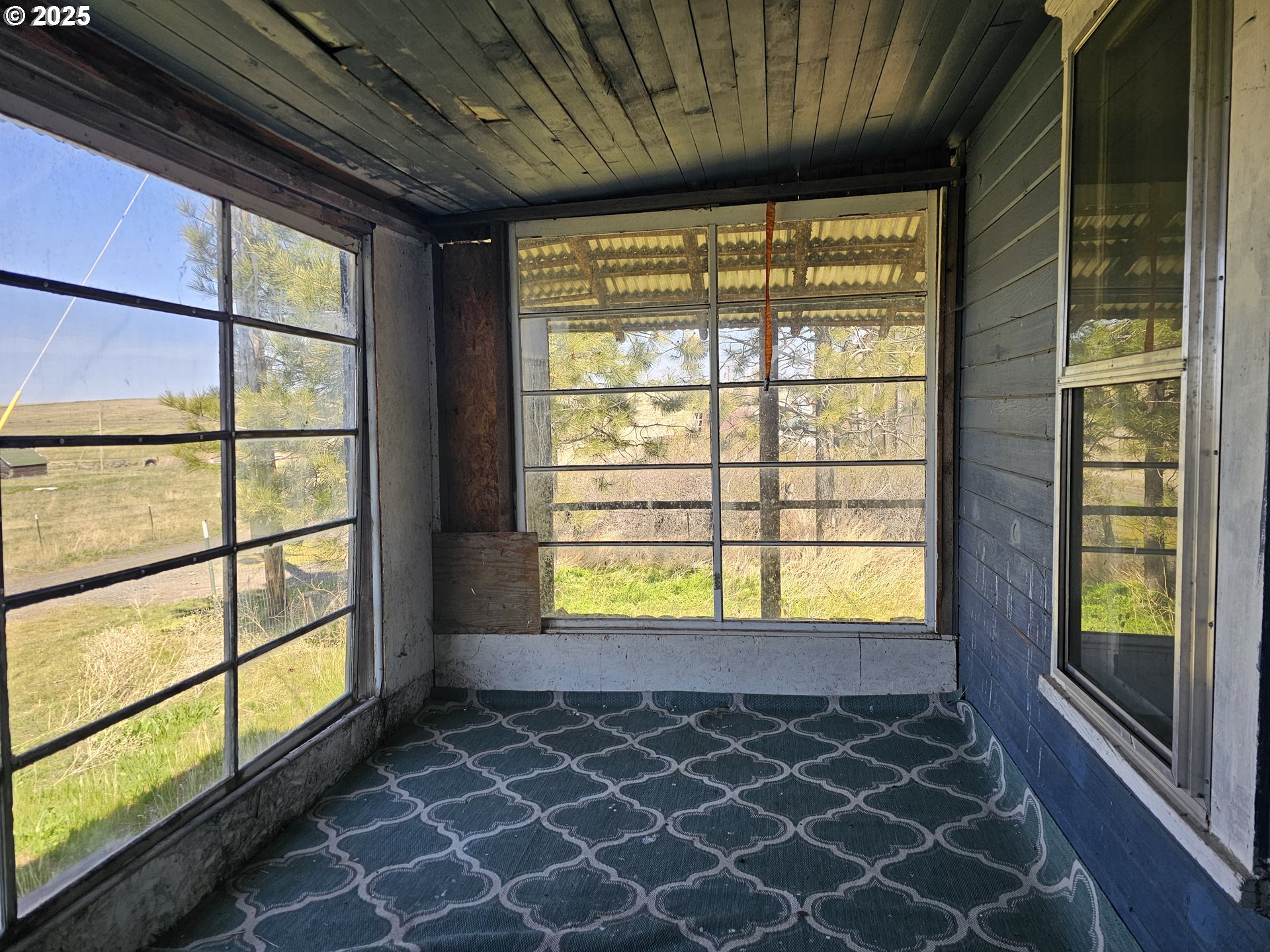 54901 Willow Street Heppner, OR 97836 - Photo 9 of 39 a view of an empty room with a window