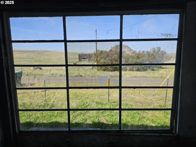 a kitchen with cabinets and stove