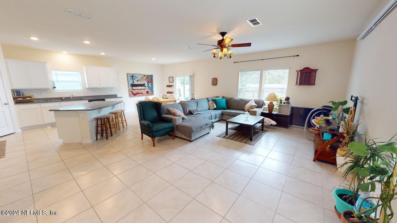 86013 Club Car Place Yulee, FL 32097 - Photo 14 of 28 a living room with furniture and a potted plant