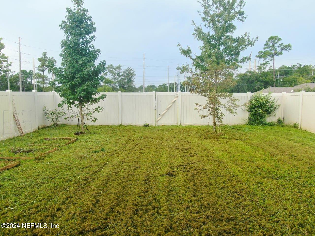 86013 Club Car Place Yulee, FL 32097 - Photo 26 of 28 a view of yard with small cabin