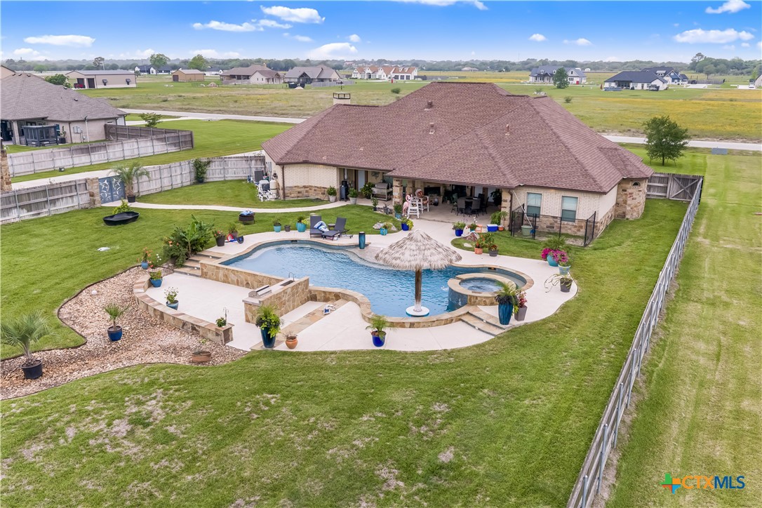 254 Sendera Loop Victoria, TX 77904 - Photo 2 of 48 an aerial view of residential houses with outdoor space and lake view