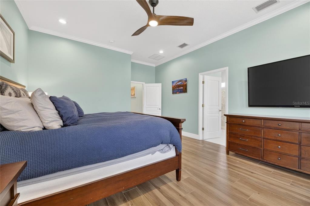 508 Islebay Drive Apollo Beach, FL 33572 - Photo 40 of 98 a bedroom with a bed and a flat screen tv