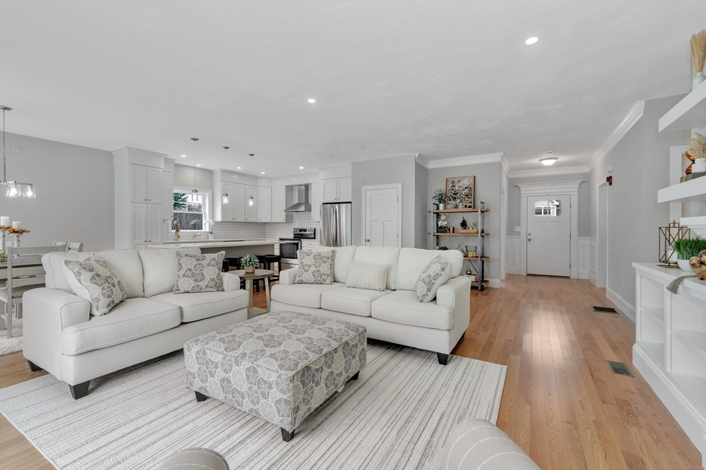 8 Weber Farm Road, Unit 8 Wrentham, MA 02093 - Photo 14 of 35 a living room with furniture white walls and wooden floor