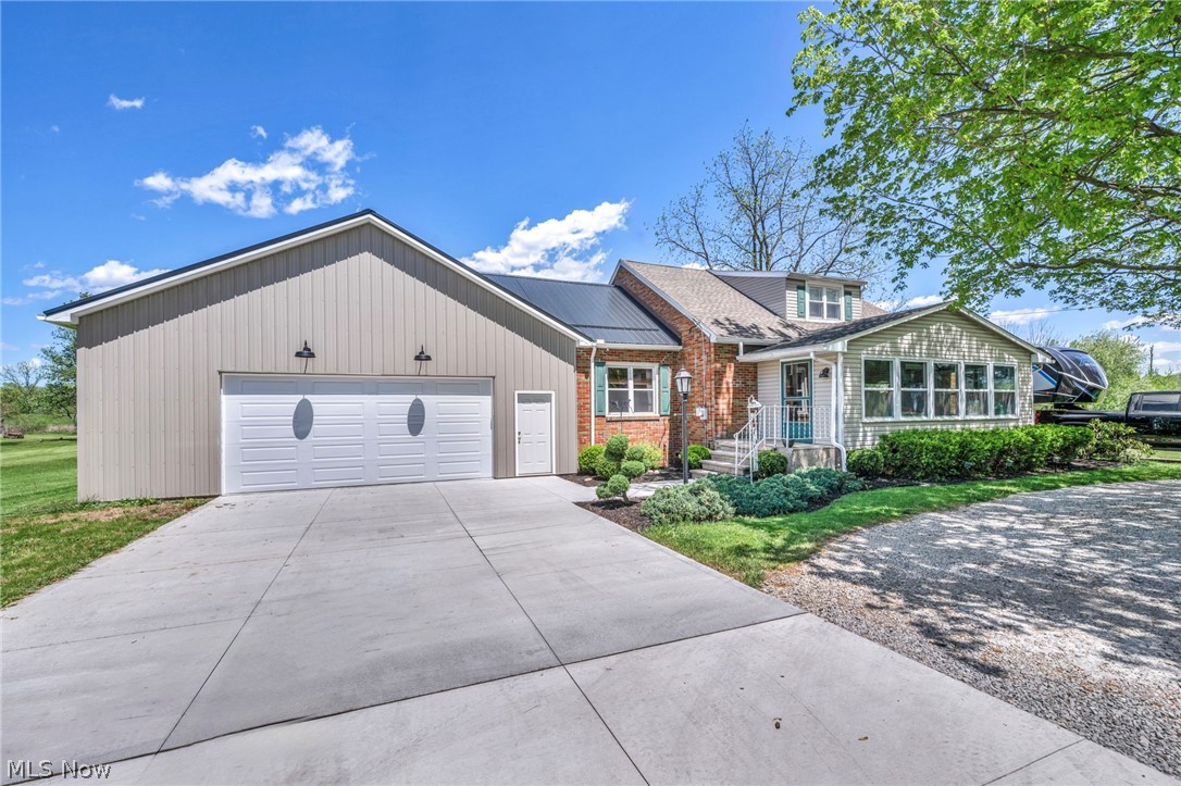7983 Wadsworth Road Medina, OH 44256 - Photo 1 of 42 View of front of home featuring a garage