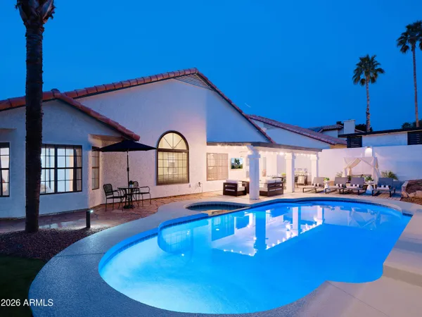 a kitchen with stainless steel appliances granite countertop a stove and a refrigerator