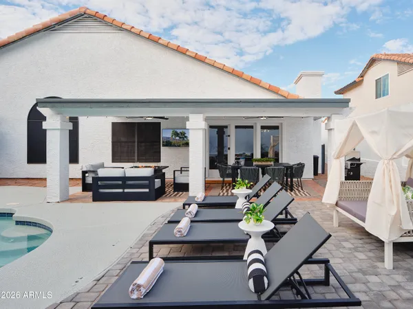 a view of living room with furniture and white cabinets
