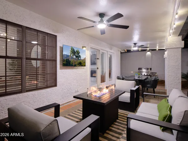 a living room with furniture and a large window