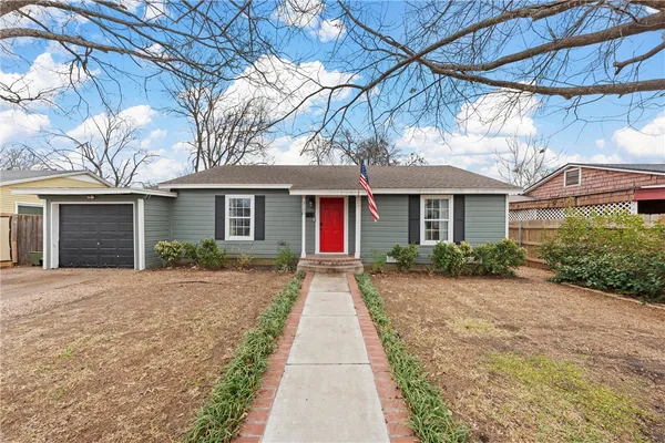 a front view of a house with yard