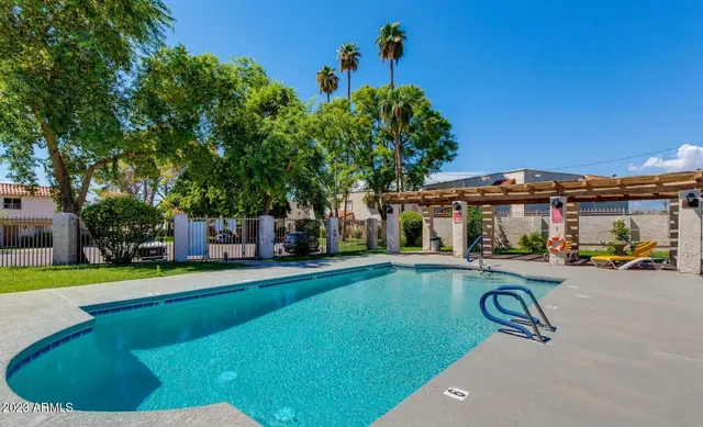 a view of a backyard with a patio and a garden