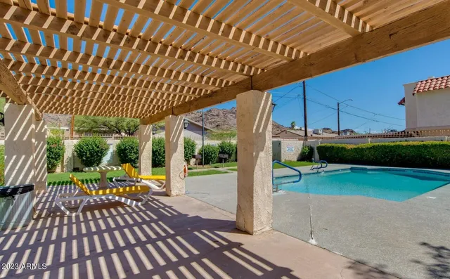 a view of a backyard with sitting area