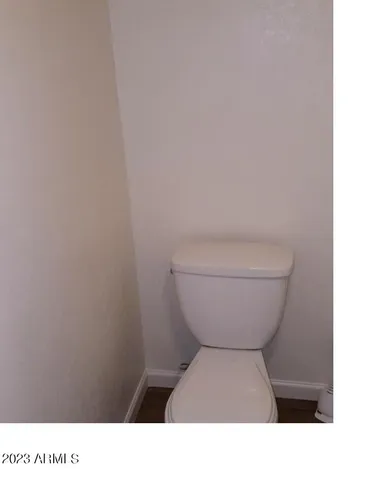 a bathroom with a toilet and a sink