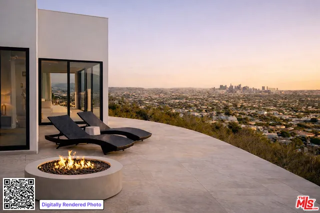 a view of a livingroom with furniture and floor to ceiling window