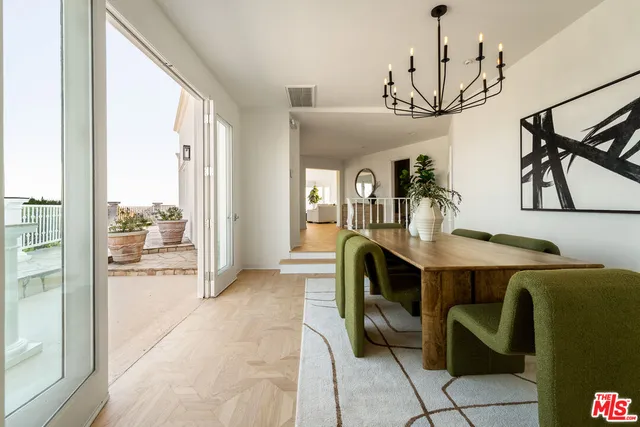 a view of a dining table chairs in the balcony