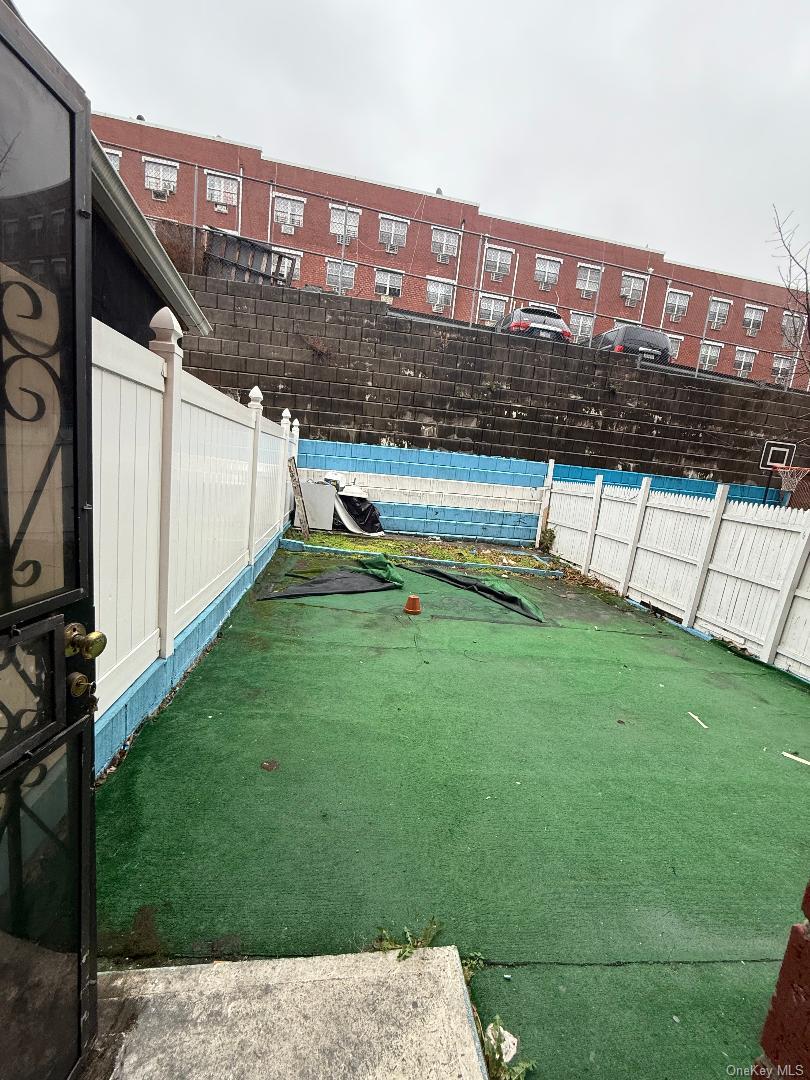 827 Longfellow Avenue Bronx, NY 10474 - Photo 3 of 16 a view of a house with a yard