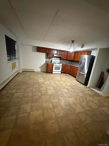 a view of room with kitchen