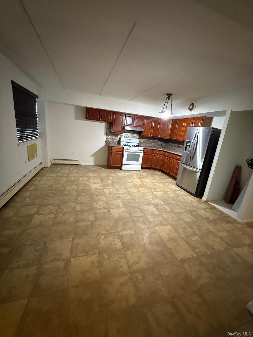 827 Longfellow Avenue Bronx, NY 10474 - Photo 5 of 16 a view of room with kitchen