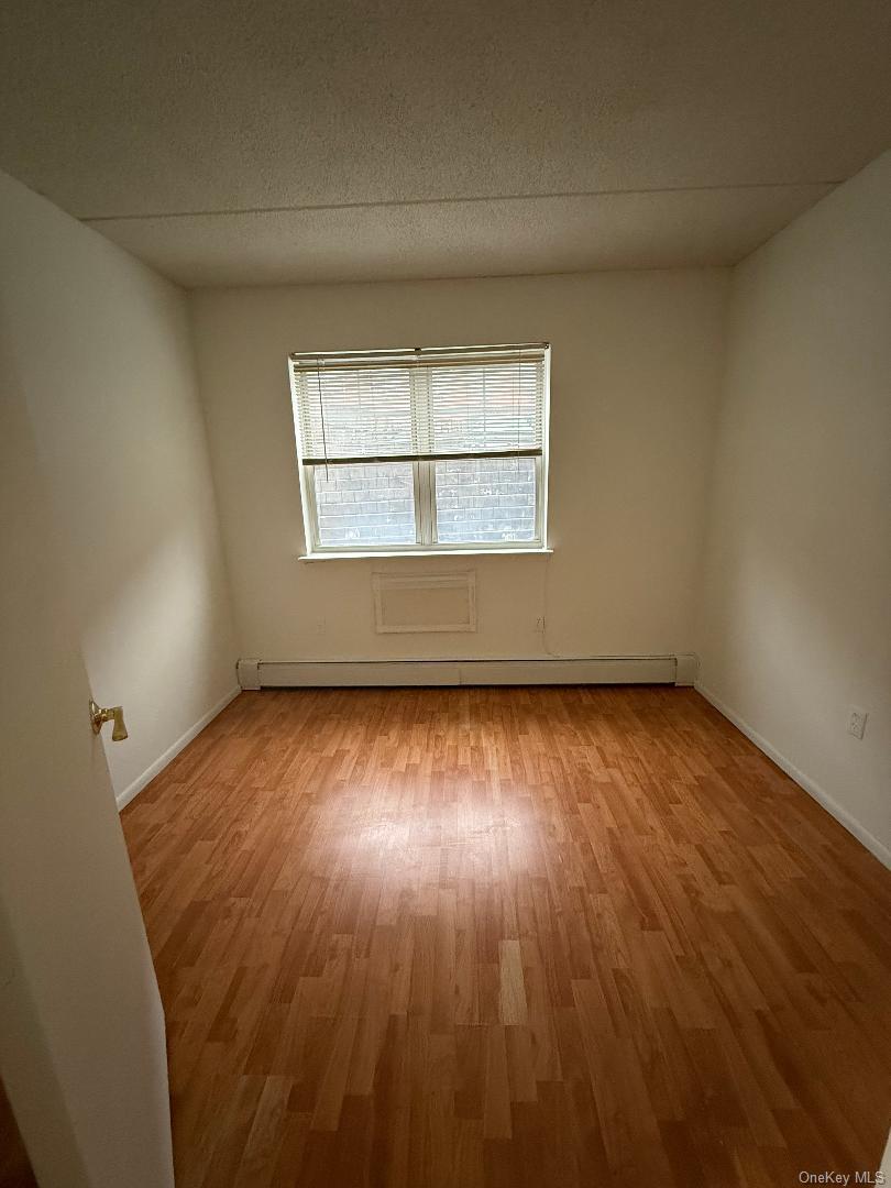 827 Longfellow Avenue Bronx, NY 10474 - Photo 10 of 16 an empty room with a window