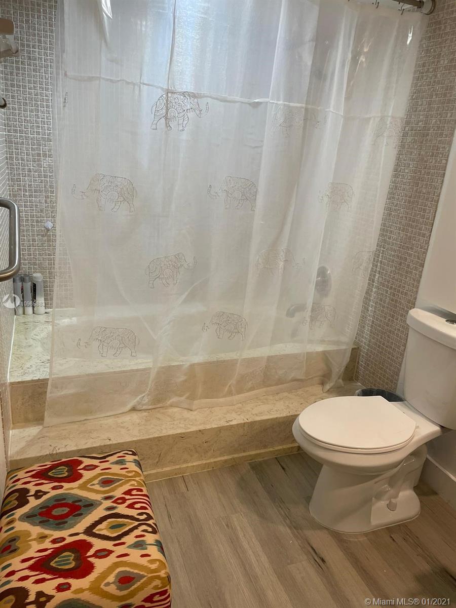 16100 Golf Club Road, Unit 210 Weston, FL 33326 - Photo 21 of 40 a bathroom with a toilet and a shower