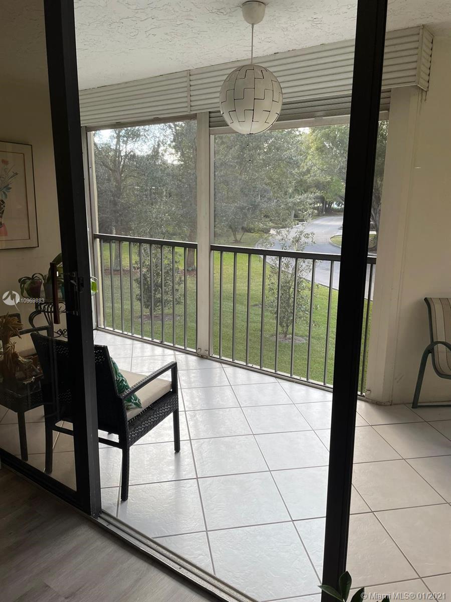 16100 Golf Club Road, Unit 210 Weston, FL 33326 - Photo 28 of 40 a view of a living room with furniture
