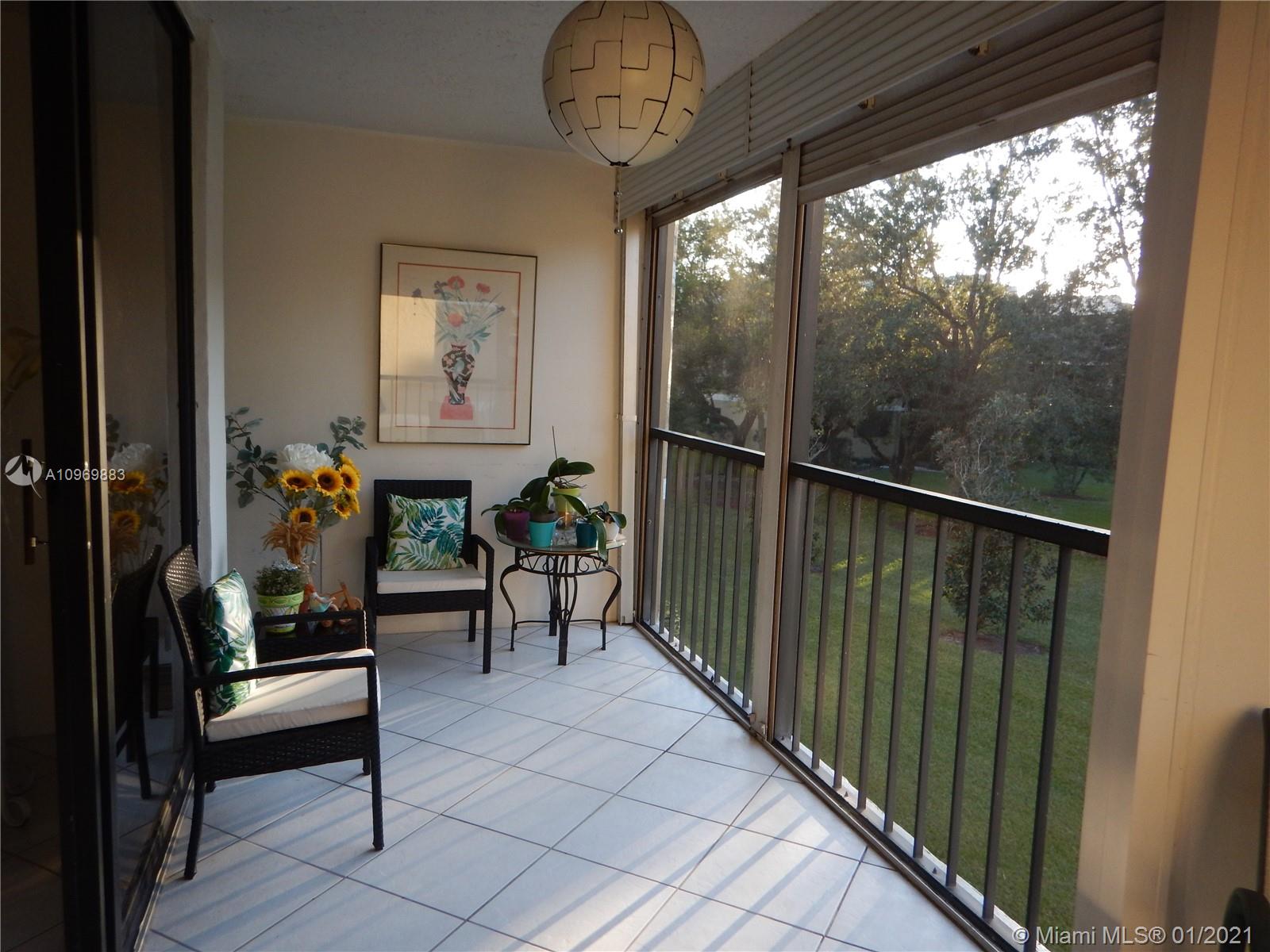 16100 Golf Club Road, Unit 210 Weston, FL 33326 - Photo 34 of 40 a view of a porch with furniture