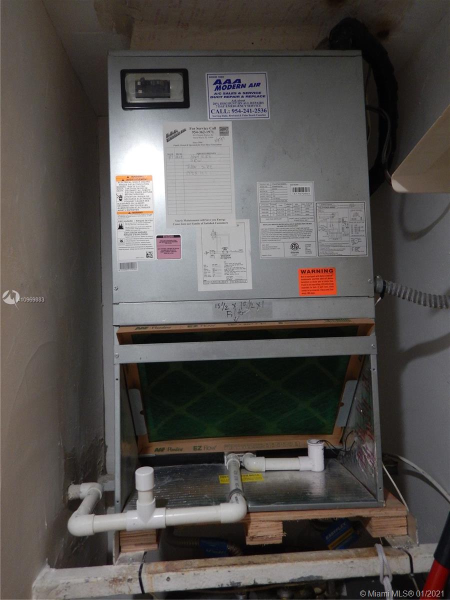 16100 Golf Club Road, Unit 210 Weston, FL 33326 - Photo 35 of 40 a room with fireplace