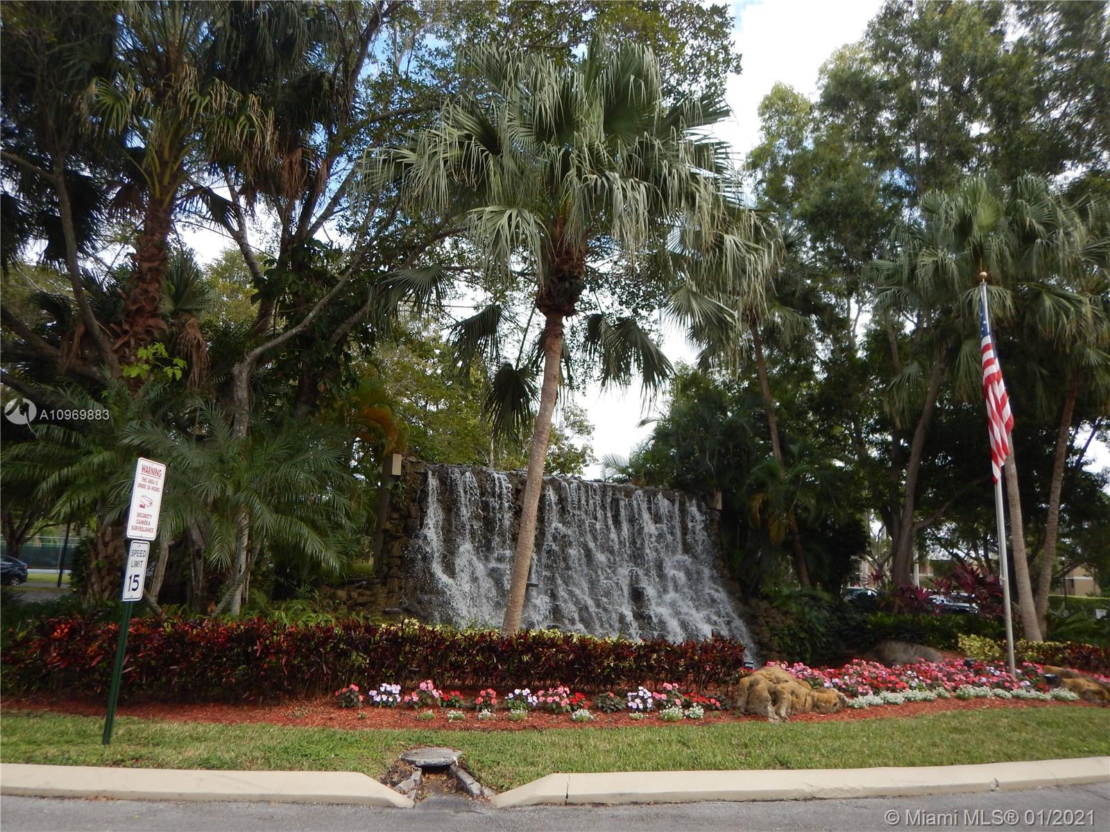 16100 Golf Club Road, Unit 210 Weston, FL 33326 - Photo 39 of 40 a view of a yard in a yard