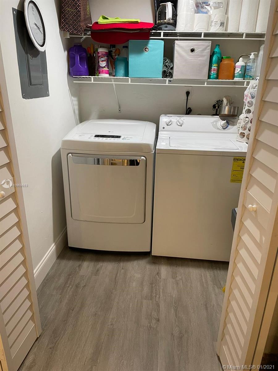 16100 Golf Club Road, Unit 210 Weston, FL 33326 - Photo 8 of 40 a utility room with dryer and washer
