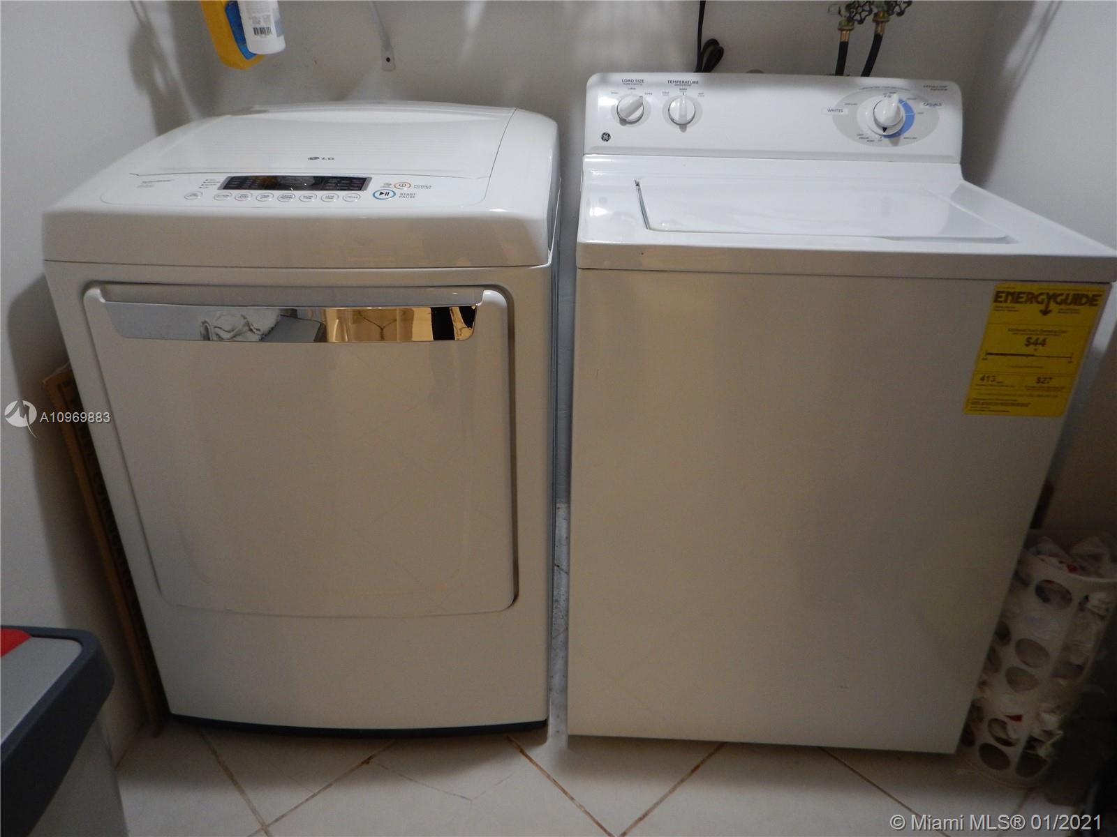 16100 Golf Club Road, Unit 210 Weston, FL 33326 - Photo 9 of 40 a utility room with dryer and washer