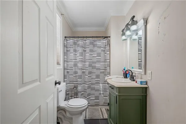 a room with bed and a window