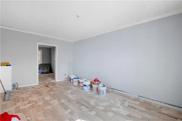a view of a room with toys and wooden floor