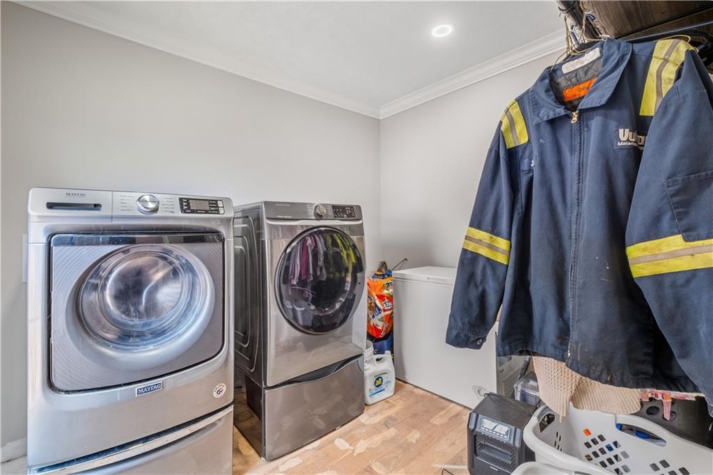 2343 County Road 60 Heflin, AL 36264 - Photo 17 of 46 a utility room with dryer and washer