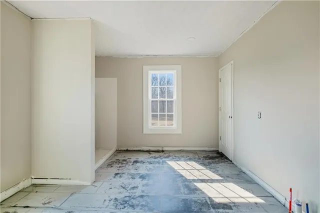 a workspace with a window and a couch