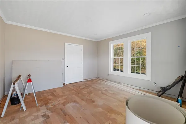 a bedroom with bed and a book shelf