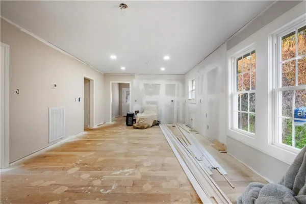 a bedroom with furniture and a bed