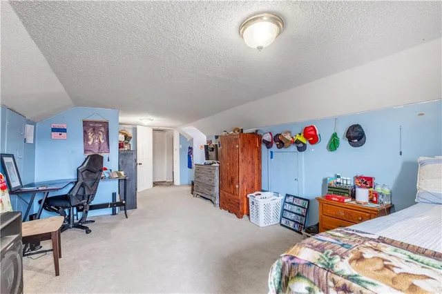 a view of house with yard and covered with snow