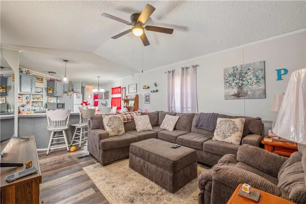 a kitchen with a dining table cabinets and stainless steel appliances