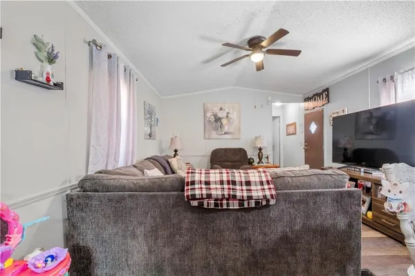 a kitchen with refrigerator cabinets and window